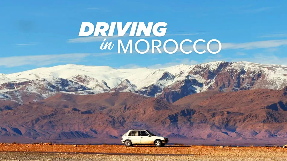 'Driving in Morocco — coastal road heading from Agadir north toward Taghazout, AgadirDrive guide.